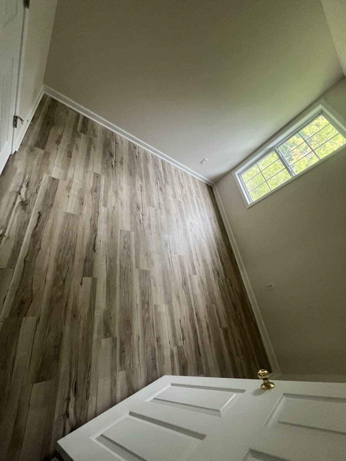 Wood-look LVP flooring installed in a bedroom