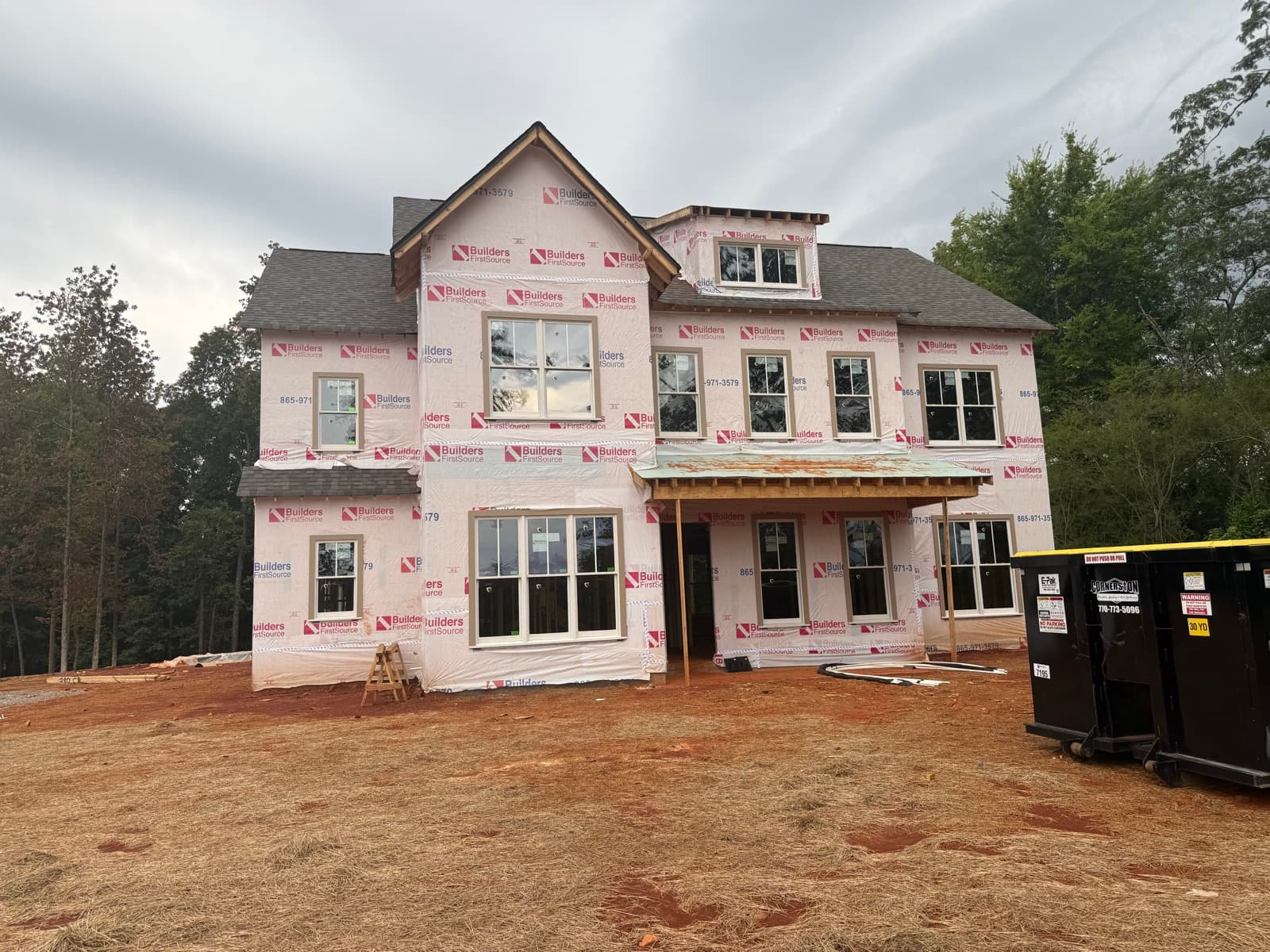 New-construction home with housewrap and new windows installed